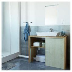 a bathroom with a sink, mirror and towel rack on the wall next to it