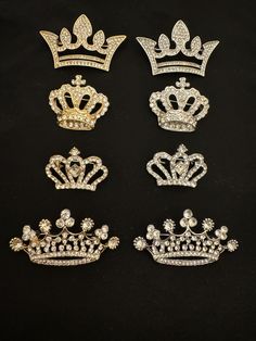 six tiaras are shown on a black surface, one is gold and the other is silver