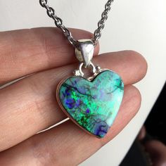 Lab made 'Monarch Opal' heart necklace, with sterling silver bezel, on your choice of stainless steel chain.  Pendant size: approx 1" x 1" Ships in a black gift box ..: V I E W   S H O P:.. www.lotusfairy.etsy.com www.shopEarthshine.com ..: P O L I C I E S :.. Please see the drop down FAQs menu All items are FINAL SALE. ★ I M P O R T A N T ★ This product is not intended to be used by, or around,  anyone under the age of 13.  ShopEarthshine.com ★ lotusfairy.etsy.com  Canadian buyers:  Prices show Nickel-free Stainless Steel Heart Pendant Jewelry, Collectible Heart-shaped Jewelry For Valentine's Day, Personalized Heart Jewelry Collectible, Personalized Heart Jewelry For Collectors, Handmade Sterling Silver Heart Pendant Jewelry, Handmade Sterling Silver Heart Cut Jewelry, Handmade Sterling Silver Jewelry With Heart Cut, Heart Cut Sterling Silver Jewelry Gift, Sterling Silver Heart Cut Jewelry With Polished Finish