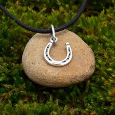 Our Horseshoe Necklace--a beautifully crafted silver charm designed to bring good luck and positive energy. This elegant horseshoe pendant captures the timeless symbol of protection and fortune, making it a meaningful accessory. Perfect as a good luck necklace, this piece of horse shoe jewelry is both stylish and significant, ideal for those who cherish the power of the horseshoe symbol. Wear it to attract good luck and embrace its enduring charm and meaning. One-sided pendant Metal: silver 925 Silver Horseshoe Charms Jewelry, Good Luck Horseshoe Charms Jewelry, Silver Horseshoe Necklace Nickel Free, Nickel-free Silver Horseshoe Necklace, Horseshoe Shaped Engraved Jewelry Gift, Engraved Horseshoe Jewelry Gift, Engraved Horseshoe Jewelry For Gift, Luck Necklace, Good Luck Necklace