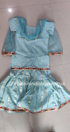 Product: Custom made girl kids dress. You will be required to submit child sizes Size : All sizes possible. Bottom Fabric: cotton gold zari Top - self butti kameez Dupatta - sequins work net Delivery Time : Please keep me informed for any dates or times frame you keeping in mind. Anarkali Palazzo Set With Ruffles For Festivals, Festive Blue Sharara With Ruffles, Ruffled Anarkali Set For Festivals, Anarkali Style Sharara Matching Set For Diwali, Festive Sharara Matching Set For Diwali, Anarkali Sharara With Matching Set For Festive Occasions, Anarkali Style Sharara For Festive Occasions, Festive Anarkali Sharara With Matching Set, Bollywood Style Sharara Matching Set For Festive