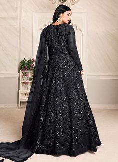 Black Sequence Embroidered Anarkali Suit In usa uk canada Shop Latest Indian Dress Collection Of Black Sequence Embroidered Anarkali Suit Online In Australia, Newzeland. This elegant set has a very pretty motif embroidery detailed with zari and sequence work on soft net top with minimalist ruffle details paired with santoon bottom and lining and equally embellished soft net dupatta. Team this beautiful attire with classic pair of heels and golden jewellery to look like a diva. This set comprises Net Anarkali, Dupatta Embroidery, Floor Length Anarkali, Salwar Suit Designs, Long Anarkali, Black Lehenga, Designer Anarkali Suits, Net Top, Gaun Fashion