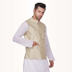 Elevate your style with our Brocade Fabric Waistcoat for men, a true embodiment of sophistication and charm. Designed to make a statement, this waistcoat adds a touch of regal elegance to your ensemble.When worn over a simple kurta and pyjama (not included), it transforms your look into one of timeless grace. Picture yourself donning this exquisite waistcoat – it exudes confidence, making heads turn at weddings, receptions, or any formal occasion.This waistcoat is more than just an accessory; it Sleeveless Nehru Jacket For Formal Festive Occasions, Festive Sleeveless Nehru Jacket For Formal Occasions, Classic Nehru Jacket For Festive Semi-formal Occasions, Elegant Sleeveless Festive Outerwear, Festive Brocade Nehru Jacket, Semi-formal Diwali Nehru Jacket, Traditional Unstitched Brocade Nehru Jacket, Gold Brocade Nehru Jacket With Long Sleeves, Grace Picture