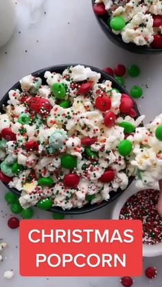 christmas popcorn with sprinkles and candy on the side in two black bowls