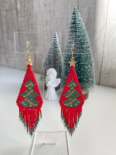 the beaded christmas tree earrings are on display