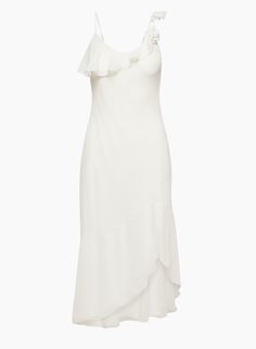 a white dress with ruffles on the shoulders