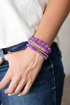 Product Description A mismatched assortment of silver, purple, and crackling purple glass-like beads are threaded along stretchy band around the wrist, creating colorful layers. Sold as one set of four bracelets. Adjustable Purple Beaded Bracelet With Silver Beads, Adjustable Purple Jewelry With Silver Beads, Purple Bracelet With Silver Beads, Adjustable Purple Faceted Beads Stretch Bracelet, Adjustable Purple Stretch Bracelet With Faceted Beads, Purple Stackable Beaded Bracelets With Round Beads, Purple Stackable Jewelry With Round Beads, Purple Bracelets, Purple Bracelet