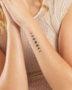 a woman with a tattoo on her arm