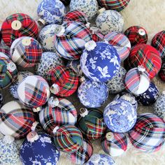 a pile of blue and red plaid christmas ornaments