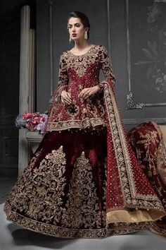 a woman in a red and gold wedding dress