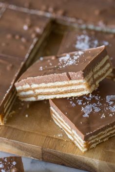 there are pieces of cake on the cutting board