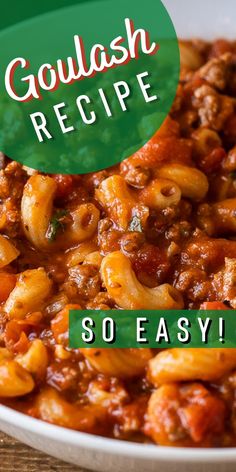 a white bowl filled with pasta and meat on top of a wooden table next to a green sign that says goulash recipe so easy