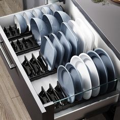 an open dishwasher with many dishes in the trays on each side and black handles