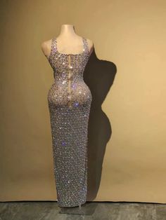 Elevate your evening with our Dazzling Handmade Evening Gown, a true masterpiece of elegance and craftsmanship. This gown is designed to make you feel like royalty, with its exquisite details and luxurious materials. The gown is meticulously crafted using the technics of beading, which adds a touch of glamour and sophistication. The intricate beading work, featuring crystals, sequins, and appliques, creates a mesmerizing effect that catches the light and makes you shine like a star. Not only is this gown stunning in appearance, but it also offers exceptional comfort and sustainability. It features anti-static properties, ensuring that you feel confident and at ease throughout the evening. The breathable and washable Spandex and Polyester blend ensures both durability and easy maintenance, Intricate Beading, Nature Dress, Nude Dress, Performance Dresses, Dance Performance, Silver Dress, Style And Grace, Long Prom Dress, Evening Dresses Long