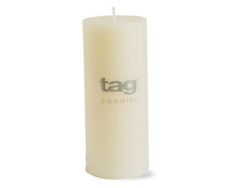 a white candle with the tag logo on it