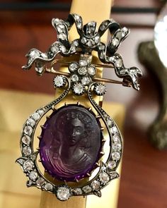 Pieces like these transcend being a piece of jewelry alone; this is history. Made some time between the early 1700's and the early 1800's, this brooch has been hand made in silver and 18K yellow gold. It is centered by a partially faceted and carved, high-relief amethyst cameo and surrounded by numerous old mine and rose cut diamonds. There is a pin closure as well as a hook on the back so that it can be hung as a pendant which is original to the piece. A stunning piece of antiquity that is not Antique Cameo Jewelry, Georgian Jewelry, Cameo Jewelry, Bow Jewelry, Diamond Brooch, High Relief, Cameo Brooch, Gorgeous Jewelry, Rose Cut Diamond