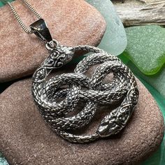 Solid Sterling Silver Celtic Snake Pendant with an 18" chain. Evokes the traditional Celtic knot shape in a perfectly balanced arrangement of stunning sterling silver - a Celtic knot to symbolize strength, love and friendship. The symbolism of the snake in Celtic culture is vast. Many Celtic legends of the snake focus on it's healing powers as well as it's ability to shed it's own skin and reemerge as it was before. The snake is a positive symbol of our ability to be reborn - of new beginnings. Celtic Snake, Positive Symbols, Celtic Legends, Celtic Knot Necklace, Celtic Culture, Love And Friendship, Snake Pendant, Snake Necklace, Crystal Design