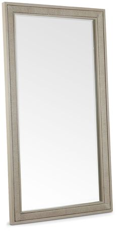 a large mirror sitting on top of a white wall