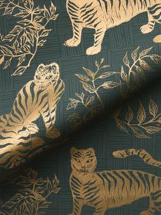 a tiger and other animals are on a blue background with gold foiled paper in the shape of leaves