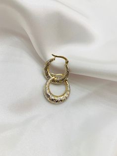 -14k shell small hoops  -2 toned design  -100%real gold  -approx dimension of 0.75'' in diameter  -great size for everyday wear  -great size for little girls  -item sold by piece. Weight undetermined Gold Hammered Huggie Earrings, Gold Diamond-cut Huggie Earrings, Gold Hammered Huggie Earrings In 14k, Gold Hammered 14k Gold Huggie Earrings, Gold Hammered Round Huggie Earrings, Gold Small Hoop Huggie Earrings With Shiny Finish, Hammered Gold Round Huggie Earrings, Gold Huggie Earrings With Diamond Cut, Gold Huggie Earrings For Anniversary