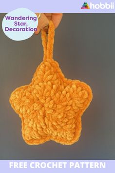 a crochet star ornament hanging from a hook with text reading wandering star, decoration free crochet pattern