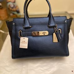 100% Authentic Coach Retail Store Style Swagger 27 , Metallic Blue Leather , Silver Hardware. Brand New Size : L 10.75" X H 7.75" X W 5" Blue Satchel With Metal Hardware For Everyday Use, Classic Blue Bags With Metal Hardware, Blue Rectangular Satchel With Silver-tone Hardware, Blue Travel Satchel With Metal Hardware, Classic Navy Bag With Gold-tone Hardware, Blue Satchel Shoulder Bag With Metal Hardware, Navy Bags With Gold-tone Hardware For Daily Use, Luxury Blue Satchel With Silver-tone Hardware, Blue Bags With Metal Hardware For Everyday Use