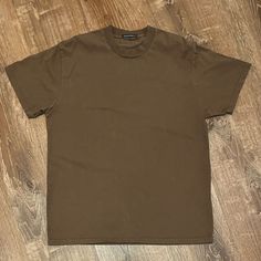 Color: Brown Size: One Size Condition: Never Worn Tops Brandy Melville, Brandy Melville Tops, Oversized T Shirt, Oversized Tshirt, Brandy Melville, Brandy, Colorful Shirts, Womens Tops, Tops & Tees