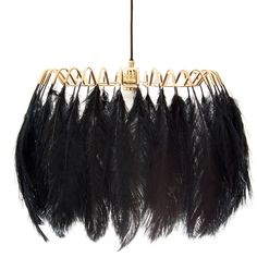 a chandelier with black feathers hanging from it's sides and gold accents