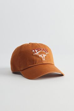 Clean Up silhouette hat by '47 Brand with a Texas Longhorns team logo at the front. Paneled cotton hat with an adjustable strap closure back. Features '47 Brand NCAA Texas Longhorns Clean Up hat Paneled baseball cap NCAA team logo Adjustable strap closure Content + Care Cotton Spot clean Imported Size Adjustable circumference | '47 Brand NCAA Texas Longhorns Clean Up Hat in Dark Orange at Urban Outfitters Collegiate Cotton Hat With Flat Brim, Collegiate Style Cotton Hat With Flat Brim, Collegiate Cotton Flat Brim Hat, Cotton Curved Bill Dad Hat For Fan Gear, Adjustable Dad Hat With Curved Brim For Sports Fans, Cotton Dad Hat With Curved Bill For Fan Gear, Cotton Dad Hat With Curved Brim For Fan Gear, Curved Brim Cotton Fitted Hat For Fan Gear, Game Day Dad Hat With Embroidered Logo