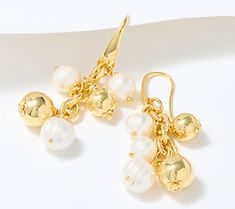 Luxe up your lobes with these elegant dangle earrings, gracefully adorned with cultured freshwater pearls and bronze beads. From Honora. Elegant Drop Pearl Earrings With Dangling Beads, Elegant Beaded Drop Earrings With Dangling Beads, Elegant Gold Earrings With Dangling Beads, Gold Pearl Drop Beaded Earrings, Elegant Beaded Drop Earrings With Pearl Charm, Elegant Beaded Dangle Earrings With Pearl Drop, Elegant Chandelier Earrings With Round Beads, Pearl Drop Earrings With Dangling Beads, Gold Dangle Beaded Earrings With Pearl Drop