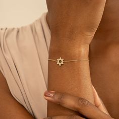 Serenity A stunning star of David lined in our perfect pavé diamonds. This captivating bracelet features a stunning Star of David charm, meticulously crafted from 14k solid gold (available in yellow, rose, or white gold). Sparkling diamonds adorn the Star of David, creating a radiant symbol of your faith. - Handmade- Solid Gold- Natural Diamonds - G Color, SI Quality Diamonds- Star Size: 12 mm- Total Diamond Carat Weight: 0.11 ctw All pieces come beautifully boxed in suede pouches you can always Elegant Star Of David Jewelry For Formal Occasions, Elegant 14k Gold Star Of David Jewelry, Elegant Yellow Gold Star Jewelry, White Gold Star Of David Jewelry Gift, Elegant Yellow Gold Star-shaped Jewelry, Diamond White Star Of David Jewelry Gift, White Gold Star Of David Spiritual Jewelry, Elegant Star-shaped Chain Bracelet As Gift, Elegant Star-shaped Chain Bracelet Gift