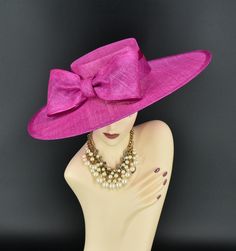 Note: The design of this hat, particularly the shallower crown, was crafted to create a unique aesthetic that suits some individuals perfectly. However, if you notice that the hat tends to slip, I would advise attaching an elastic strap to ensure a more secure and comfortable fit. ✿*.Key Features.*✿ This is a wide flat brim hat!! It's made of sinamay (3 layers ) and satin.  A nice sinamay bow is trimmed with satin ribbon too, very cool, one of my favorite hats! High quality. It's more beautiful in person! Great for Kentucky derby, weddings, church, Easter, Royal Ascot, horse races, cocktails, tea party, or any hat wearing occasion. Hat base size: From front to back: 19" (48cm) From left to right: 18.25" (46cm) Wide brim appr: 6" (15cm) Crown Depth: 3.5" (9cm) Hat girth: 21" (53.34cm). It f Pink Elegant Boater Hat With Curved Brim, Elegant Pink Boater Hat With Curved Brim, Pink Formal Hat For Royal Ascot, Elegant Pink Curved Brim Boater Hat, Elegant Pink Wide Brim Boater Hat, Elegant Pink Straw Hat For Wedding, Pink Wedding Hat With Structured Crown, Top Hat With Pinched Crown For Races, Pink Structured Crown Hat For Kentucky Derby