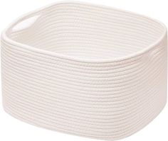 the large white basket is made out of rope and has a rounded design on it