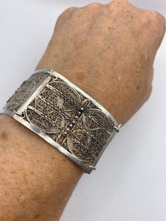 Gorgeous links handcrafted Yemenite filigree bracelet sterling silver 925  7 inches long for a smaller wrist  1.25 inches wide  All jewelry is shipped in a nice gift box.   Check out our over a THOUSAND great reviews Engraving is $4 per letter and is not always perfect depending on the piece. It can take a few days if the jeweler is busy. This is payable to Paypal Judithsltd@gmail.com Ornate Sterling Silver Bracelets With Silver Clasp, Ornate Sterling Silver Bracelets, Victorian White Gold Bracelets As Gift, Victorian White Gold Bracelets For Gift, Victorian White Gold Bracelets Gift, Etched Sterling Silver Bracelet For Formal Occasions, Formal Etched Sterling Silver Bracelet, Elegant White Gold Sterling Silver Bracelet With Intricate Design, Ornate Sterling Silver Engraved Bracelet