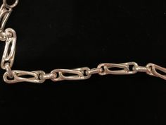 Beautiful vintage sterling silver chain link bracelet with a snap-lock closure. The bracelet has a beautiful design. It measures 8.25 inches in length. There are a few minor superficial scratches. Formal Chain Link Bracelet With Hook And Links, Formal Sterling Silver Bracelet With Clasp, Silver Chain Link Bracelet For Formal Occasions, Formal Chain Link Bracelet With Sterling Silver Clasp, Formal Sterling Silver Link Bracelet With Chain Detail, Formal Bracelet With Oval Link Clasp, Formal Sterling Silver Link Bracelet, Formal Silver Chain Bracelet With Oval Links, Formal Chain Link Bracelet With Clasp