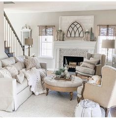 a living room filled with furniture and a fire place