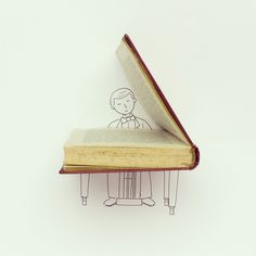 an open book with a drawing of a person sitting at a desk on top of it