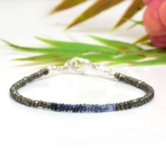 Skinny Pyrite & Ombre Blue Sapphire Bracelet in Sterling This bracelet is very dainty - beads measure about 3-4mm apiece AAA Quality Please Feel Free To Contact If You Have Any Query. Orders are shipped within 1 business working day, excluding orders made on Sunday or national holidays. Domestic delivery takes 5-7 business days. International delivery takes 11-23 business days. PAYMENT METHOD : PayPal only Please send all payments within 7 days . Return policy: We are very confident on our fine Adjustable Sapphire Bracelets With Gemstone Beads, Adjustable Sapphire Bracelet With Gemstone Beads, Adjustable Faceted Sapphire Bracelet, Adjustable Faceted Sapphire Bracelets, Faceted Sapphire Beaded Bracelets As Gift, Sapphire Round Faceted Bead Bracelets, Adjustable Beaded Sapphire Bracelets, Adjustable Beaded Sapphire Bracelet, Gift Sapphire Beaded Bracelets With Faceted Beads