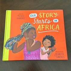 a children's book with an african woman holding a comb