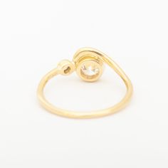 This ring captures a graceful, rolling wave in solid gold to curl around a bezel-set diamond. Accentuated by another, smaller diamond to the side, this center diamond within its golden frame. The low-profile design welcomes an active lifestyle, without compromising size or impact. This alternative engagement style can be worn with the matching band for a perfect pairing to treasure forever. Made in the U.S.A. 14 karat gold with 0.25-0.3ct Modern Brilliant Cut White Diamond (recycled, VS clarity, Golden Frame, Engagement Style, Bezel Set Diamond, Matching Band, Profile Design, Active Lifestyle, Bezel Setting, White Diamond, Low Profile