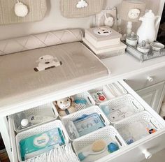 an organized baby changing table in a nursery