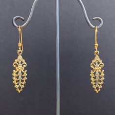 Here is a lovely pair of dainty ornate floral dangle earrings. These were actually made in the early seventies. They are good quality, new (unused) vintage items, made of gold plated brass. 9mm wide x 45mm high (with earwire) BOY66 IMPORTANT: please note that I offer different earwires as seen in second picture, and the price of the earrings vary depending on the chosen earwires.  It goes as follows: A: gold plated base metal french wires with ball (rubber stoppers included).  B: gold plated bas 70s Earrings, Baroque Floral, French Wire, Delicate Earrings, Everyday Earrings, Etsy Earrings Dangle, Floral Earrings, Base Metal, Earrings Gold