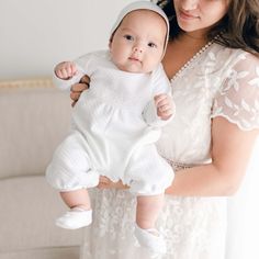 Mother holding her newborn baby who is wearing the Elijah Newborn Romper made from a plush white quilted cotton, featuring white Venice lace at the bodice and white linen trim at the cuffs and neck White Long Sleeve Bubble Romper For Loungewear, White Long Sleeve Onesie For Baptism, Christening Gowns For Boys, Newborn Baby Boy Clothes, Baptism Outfit, Boy Christening, Baby Boy Clothes Newborn, Newborn Baby Boy, Take Home Outfit