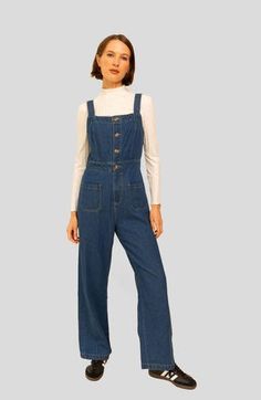 Crafted from organic cotton dark denim, our Grace Jumpsuit is the perfect transitional piece. Featuring overalls with front and back patch pockets, as well as a four-button front closure and high waist, the jumpsuit flows into wide-leg pants for an ankle-grazing length. Adorned with undeniable charm yet ultra-comfortable, this classic wardrobe staple is great for layering. True to size Button front Front Zipper Adjustable straps For best results wash on delicate cycle (or hand wash) on cold with Coverall Jumpsuit, Classic Wardrobe Staples, Classic Wardrobe, Back Patch, Dark Denim, Front Zipper, Jumpsuits For Women, Leg Pants, Wide Leg Pants