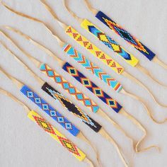 six wooden sticks with different designs on them