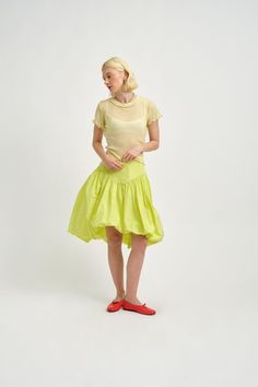 We love a classic layering tee and so we made one out of this super soft butter yellow tencel/wool blend fabric. It's super soft and lightweight and has a slightly ribbed effect - perfect on it's own or layered under any of our dresses! - Slips on over head - 70% Tencel, 30% Wool - Butter yellow colour - Machine wash cool water and lay flat to dry Fitted Yellow Tops For Layering, Fitted T-shirt For Spring Layering, Fitted Top T-shirt For Spring Layering, Yellow Clothes, Bubble Skirt, Green Skirt, Oversized Tee, Hip Length, Tulle Dress