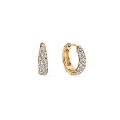 A classic twist on the pave huggie earring for a timeless accessory that embodies understated refinement. Crafted from gleaming gold and sparkling diamonds, these earrings feature a snug, hoop-like design that "hugs" the earlobe closely. Their simplicity and versatility make them an essential addition to any jewelry collection, effortlessly complementing both casual and formal looks. Available in 14K White, Yellow, and Rose Gold Diamond weight = 0.53 carats Diamond quality = GH-Color, SI-Clarity Luxury Huggie Earrings With Shiny Finish, Luxury Round Huggie Earrings, Luxury Modern Round Huggie Earrings, Luxury Round Channel Set Huggie Earrings, Luxury Cubic Zirconia Halo Huggie Earrings, Luxury Diamond Huggie Earrings As Gift, Luxury White Gold Pave Setting Earrings, Timeless Luxury Huggie Earrings For Anniversary, Luxury White Elegant Huggie Earrings