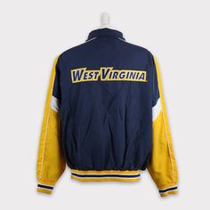 Vintage 90s West Virginia Mountaineers Sweatshirt XL West Virginia T-shirt West Virginia University West Virginia Football Sweater Jacket 💯 SATISFACTION AND AUTHENTICITY ⭐ MEASUREMENTS (when laid flat) Size on Tag: XL Length: 74cm or 29.5 inches Armpit to armpit: 70cm or 27.5 inches ⭐ CONDITION 9/10 (Very good) Details: No holes Material: Cotton Vintage Top For Fall Sports Events, Vintage Tops For Sports Events In Fall, Vintage Tops For Fall Sports Events, Cotton Crew Neck Track Jacket For Sports, Casual Crew Neck Track Jacket For Sports Events, Casual Crew Neck Track Jacket For Sports, College Winter Windbreaker With Crew Neck, Throwback Cotton Track Jacket For Streetwear, Casual Crew Neck Track Jacket For College