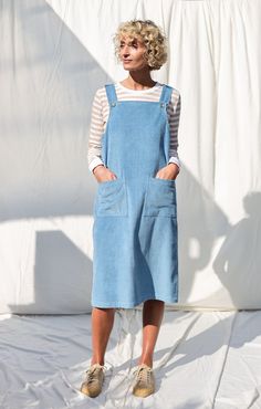 "We believe in handmade! Every piece is dedicated and made to the person who ordered it by using old traditional skills. About the dress: A high-quality pinafore dress made from a soft six-wale cord fabric. Comfortable fit, elegant and casual look. - Handmade in our studio  - Pinafore style - Detachable braces  - Front square pockets - Straight-cut body - Slit on the backside - Available from XXS to XXL size or can be made in a custom size - Available in any other color of the listed cord FABRIC Cords Outfit, Cord Pinafore Dress, Blue Colour Dress, Vegan Cafe, Style Finder, Pinafore Dress, Cafe Design, Light Blue Color, Lithuania