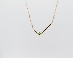 This minimalist solid gold necklace features a simple geometric L shape gold bar with a single square shape emerald, for an asymmetrical look that's both simple and strikingly graphic. The piece looks equally good worn alone or stacked with other styles.details: 18k yellow gold the square shape emerald is measured 2mm x 2mm the L shape is measured 8mm x 16.5mm 18” length with 2” extender spring-ring closure One piece in 18k yellow gold in stock, ready to ship! Gold Emerald Necklace For Formal Occasions, Gold Emerald Necklace For Formal Events, Minimalist Yellow Gold Emerald Necklace, Minimalist Emerald Necklace For Formal Occasions, Minimalist Rectangular Emerald Jewelry, Minimalist Formal Emerald Necklace, Formal Minimalist Emerald Necklace, Minimalist Gold Emerald Necklace, Minimalist 14k Yellow Gold Emerald Necklace